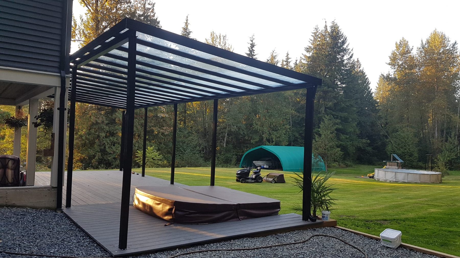 Freestanding stand-alone aluminum cover over a hot tub deck